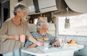 Renting an RV(/renting-an-rv/) – Elderly couple in travel vacation inside a camper 2023 11 27 05 00 04 utc